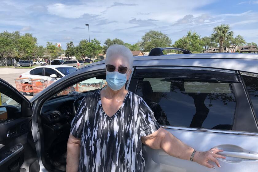 Priscilla Skalka of Pinellas Park, Fla., standing by her car.