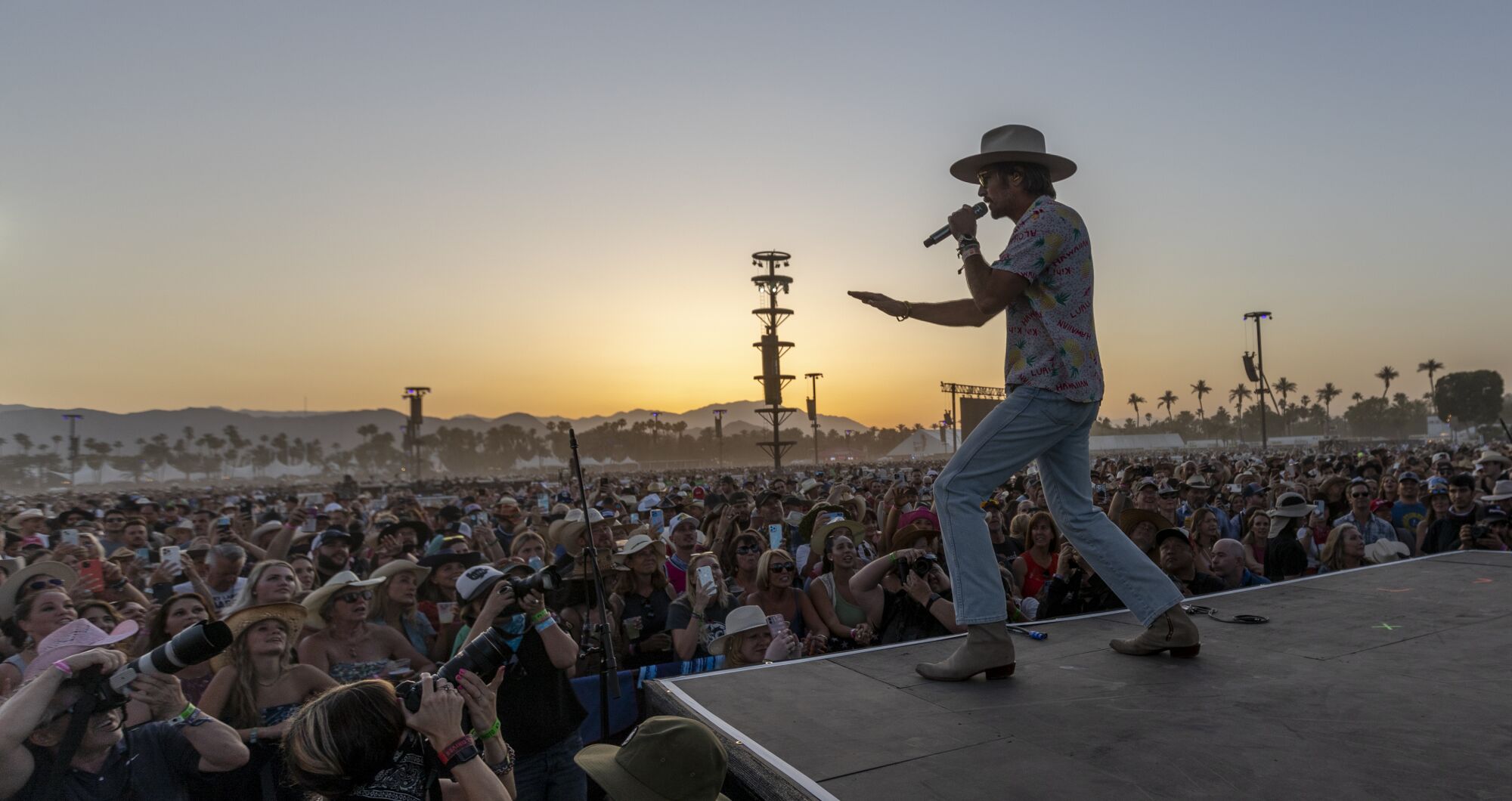 Mark Wystrach gestures to the crowd while singing onstage