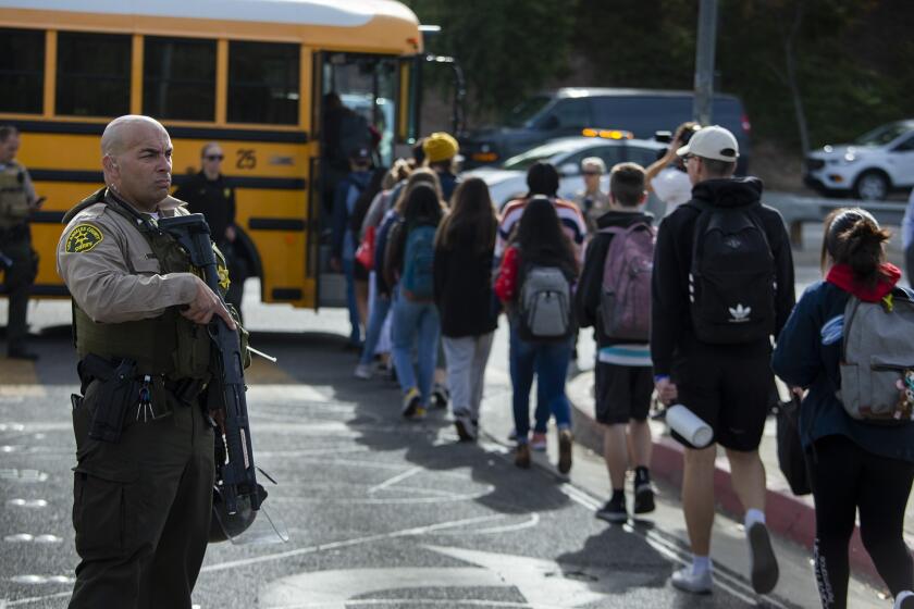 Photographs by Brian van der Brug  Los Angeles Times SAUGUS HIGH SCHOOL students board buses en route to a family reunification area after Thursday morning’s deadly shooting at the Santa Clarita campus.