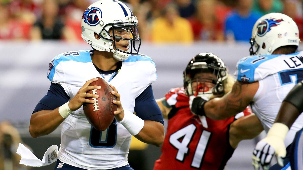 Titans rookie quarterback Marcus Mariota drops back to pass against the Falcons in the first quarter of a preseason game on Friday night in Atlanta.