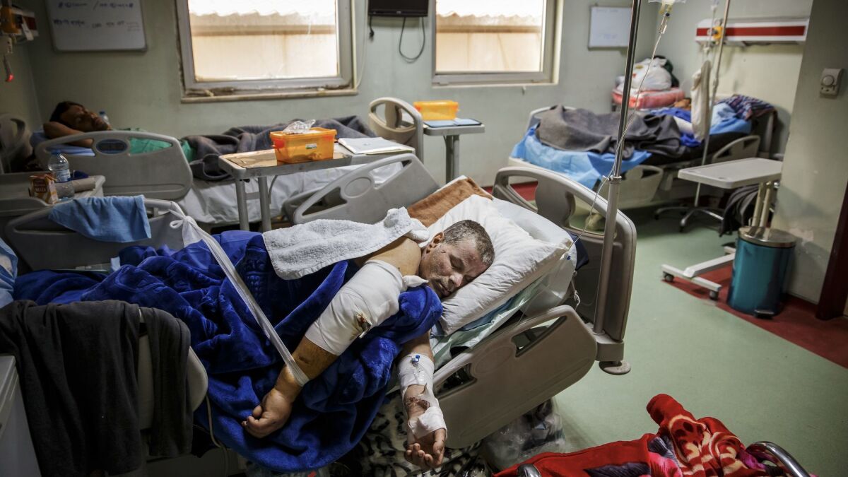 Ali Thanoon recovering from surgery in March. Thanoon lost more than 50 members of his family in a U.S. airstrike during the battle against Islamic State in Mosul, Iraq.