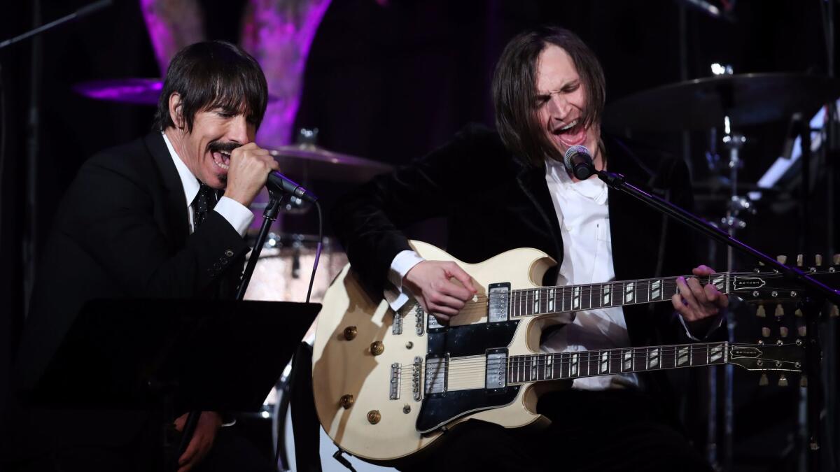Anthony Kiedis and Josh Klinghoffer of the Red Hot Chili Peppers performs onstage at the Whole Child International's inaugural gala in Beverly Hills.