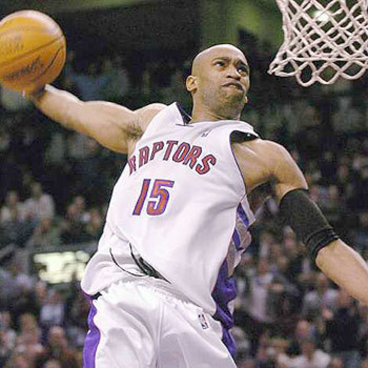 Vince Carter elevates for a slam dunk during his playing days with the Toronto Raptors.
