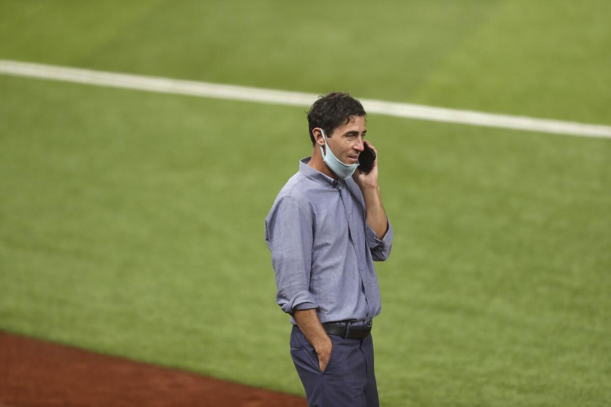 General Manager A.J. Preller of the San Diego Padres talks on the phone