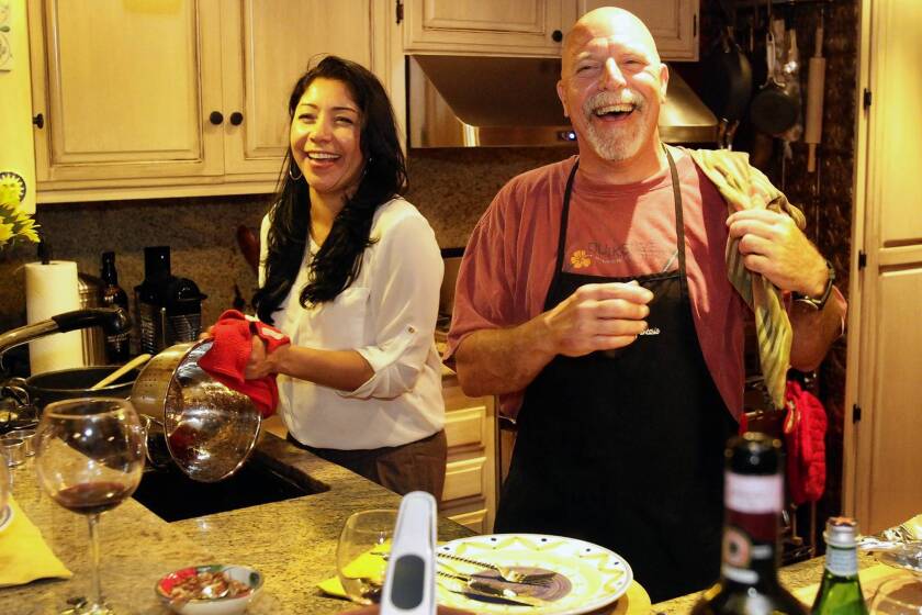 Lakers trainer Gary Vitti and his wife, Martha, cook for friends at their home in Manhattan Beach.