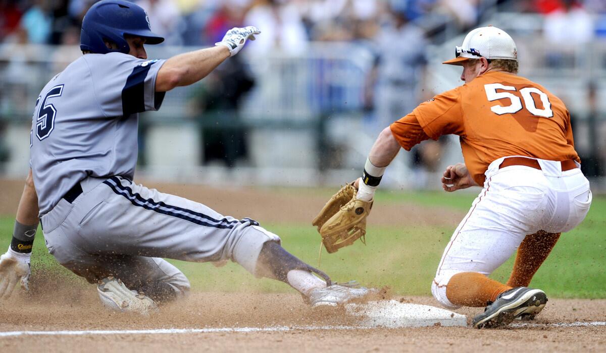 UC Irvine's Taylor Sparks slides in safely to third base as Texas' Zane Gurwitz fields the throw with a run-scoring triple in the eighth inning on Saturday in a College World Series opener.
