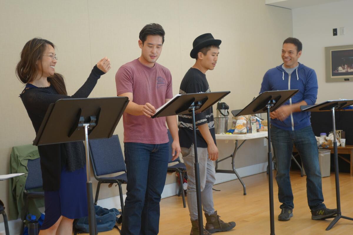 Samantha Quan, Raymond Lee, from left, Lawrence Kao and Paco Tolson rehearse for SCR's upcoming "Vietgone" by Qui Nguyen.