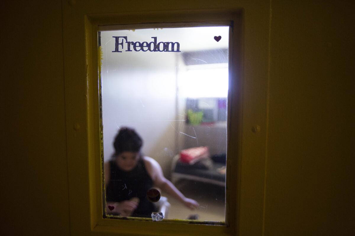 Irma, 18, placed the stickers reading "Freedom" on the window of her door.