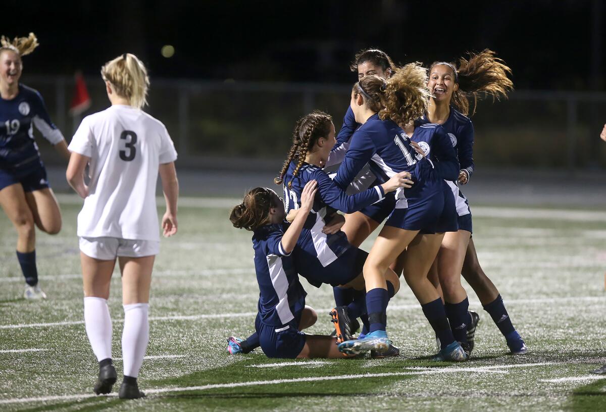 Newport Harbor players celebrate a goal in the Battle of the Bay match against Corona del Mar on Thursday.