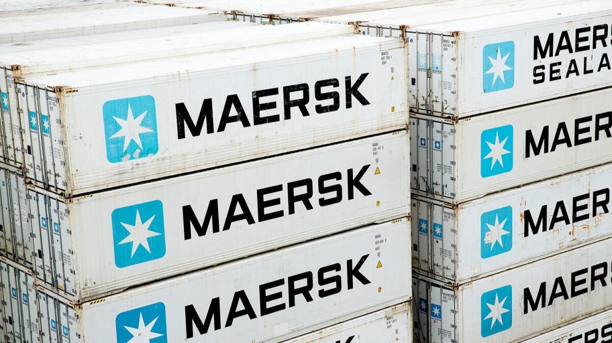 Maersk containers rest on a ship in the Panama Canal in 2014.
