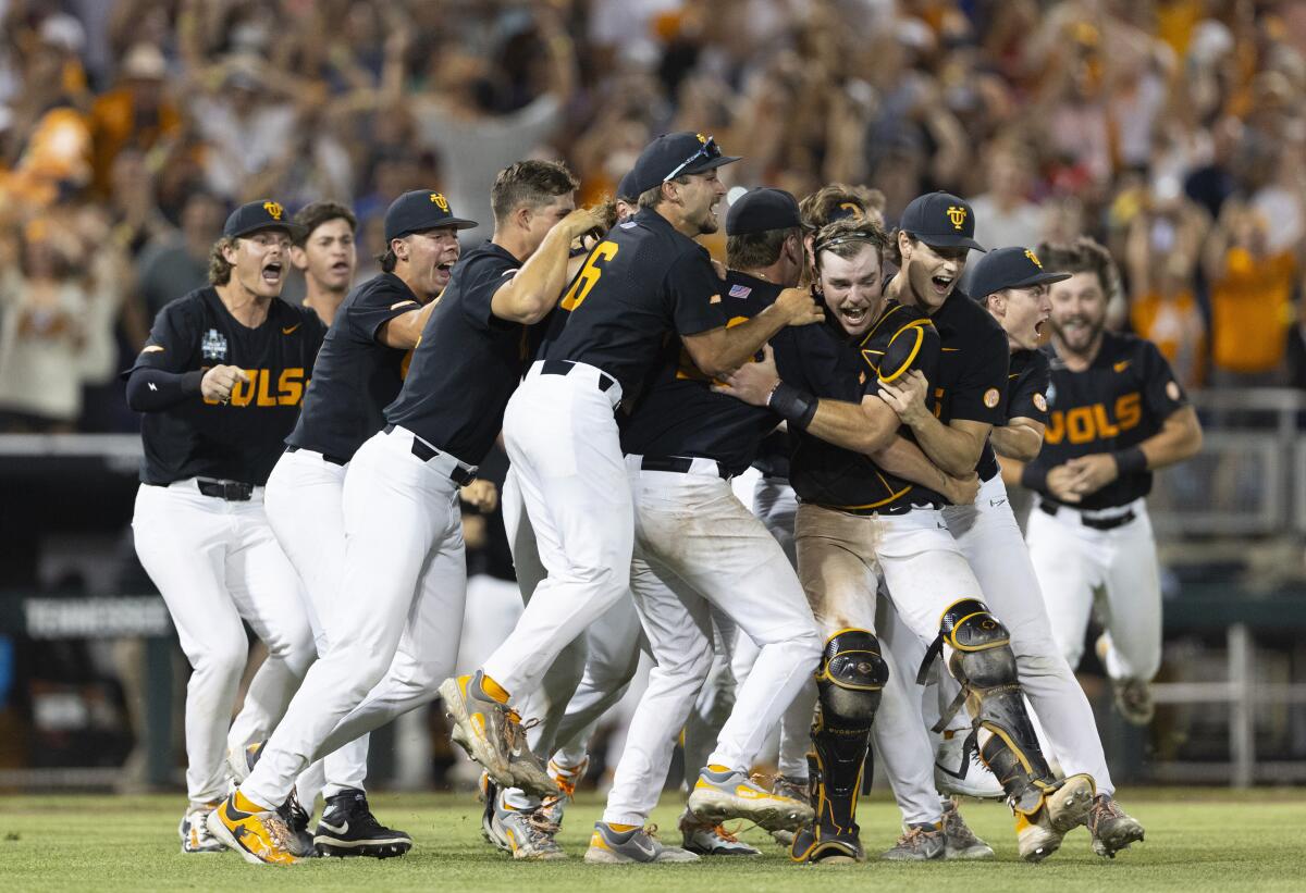 Tennessee players celebrate their 6-5 victory over Texas A&M for the College World Series title on Monday.
