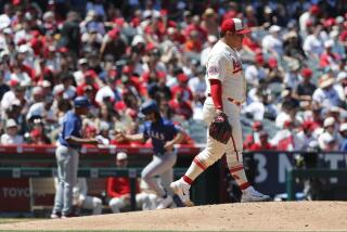 ANAHEIM, CA - MAY 7, 2023: Los Angeles Angels starting pitcher Jose Suarez (54) walks back to the mound.