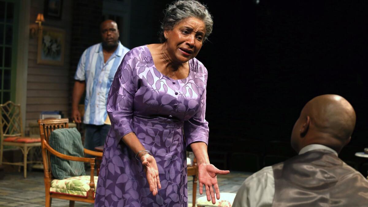 Phylicia Rashad stars in Tarell Alvin McCraney's "Head of Passes" at the Mark Taper Forum in Los Angeles, playing the mother of Spencer (J. Bernard Calloway, in back) and Aubrey (Francois Battiste, foreground).