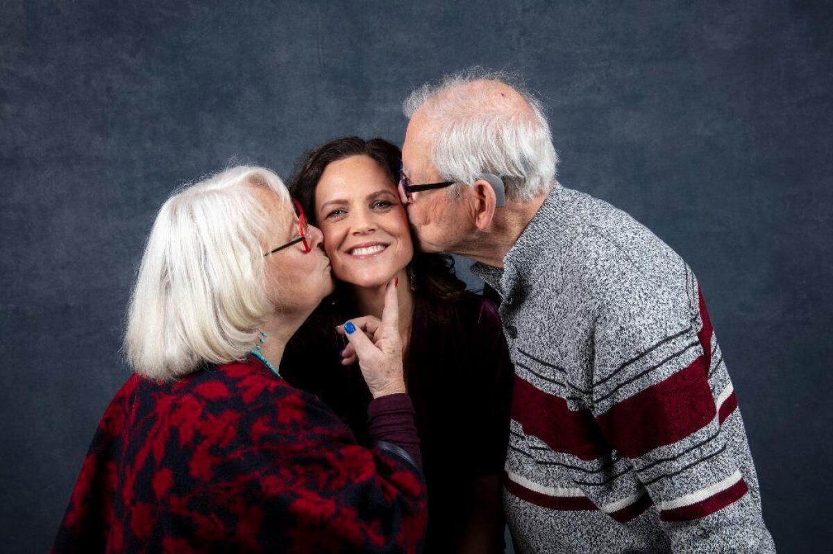 Director Irene Taylor Brodsky gets a kiss from parents Sally and Paul Taylor.