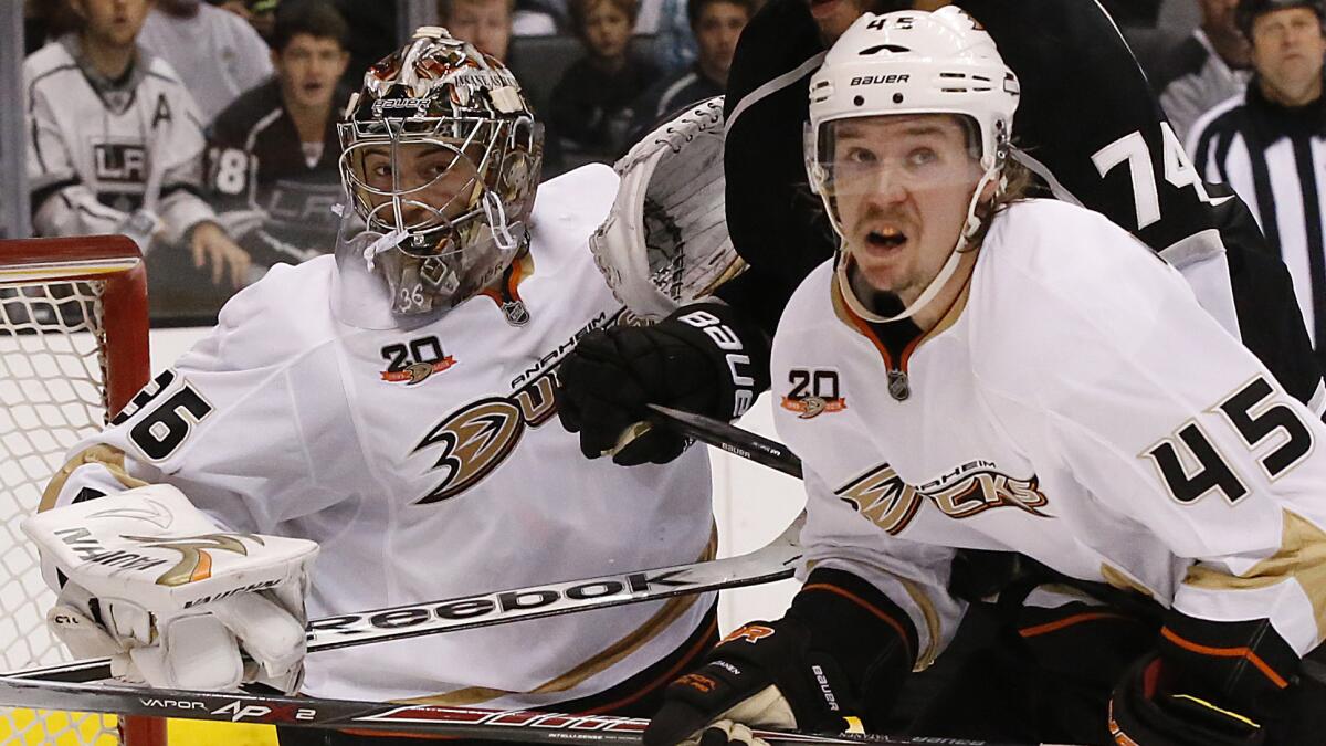 Ducks goalie John Gibson and defenseman Sami Vatanen keep their eyes on the puck during the team's win over the Kings in Game 4 of the Western Conference semifinals Saturday. Gibson will be back in the crease for Game 5.