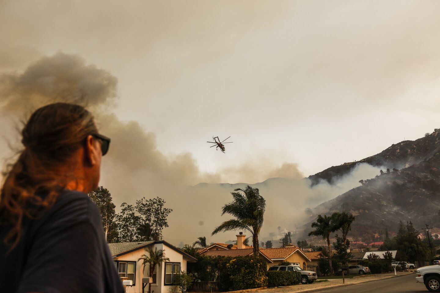 Helicopters make drops near homes threatened by the Holy fire in Lake Elsinore.