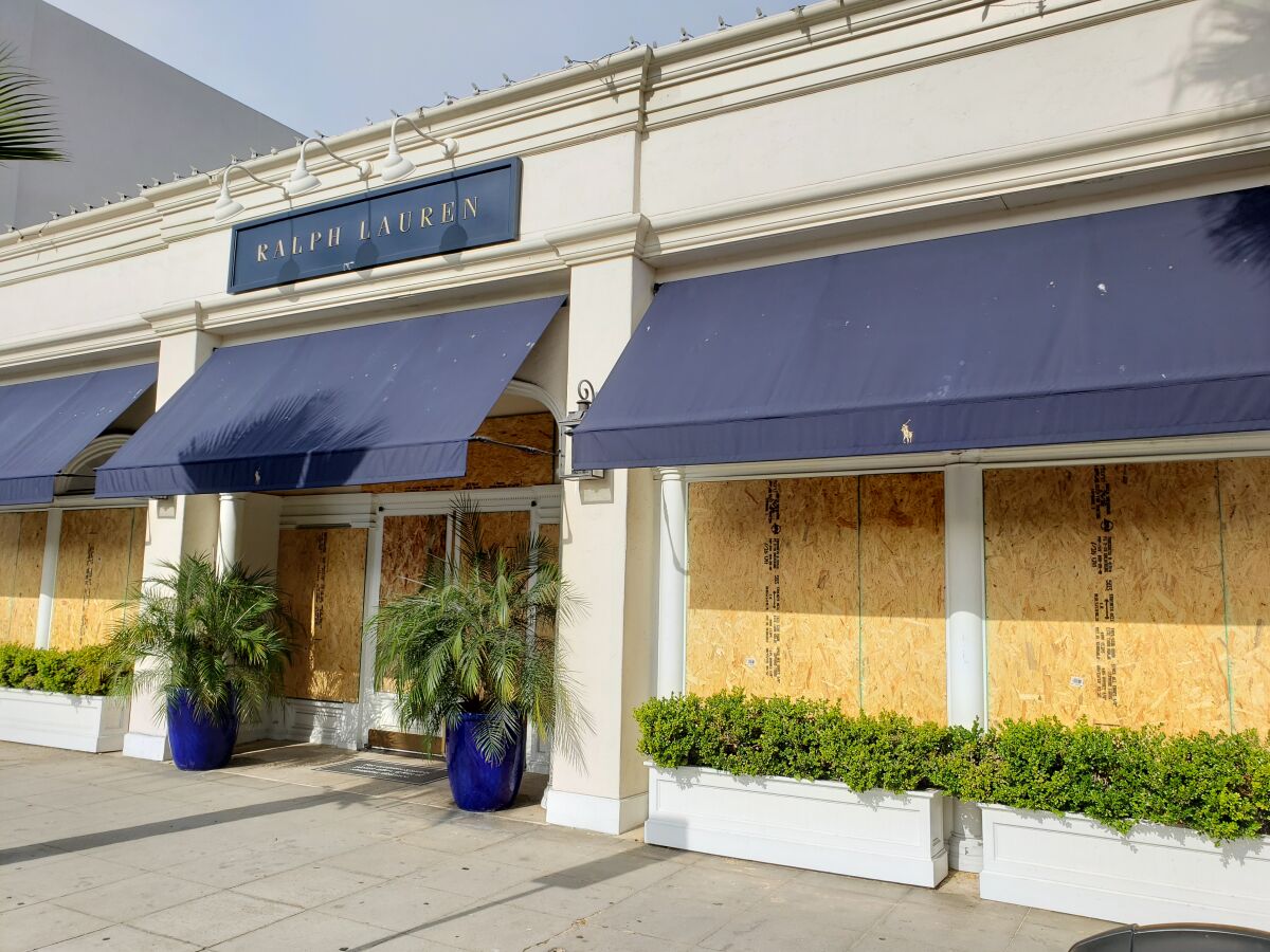 The Ralph Lauren shop at 7830 Girard Ave. in La Jolla was boarded up the morning of June 2.