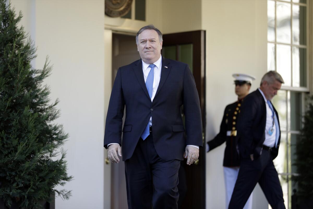 Secretary of State Mike Pompeo walks out of the White House to talk to the media after briefing President Trump on Thursday.