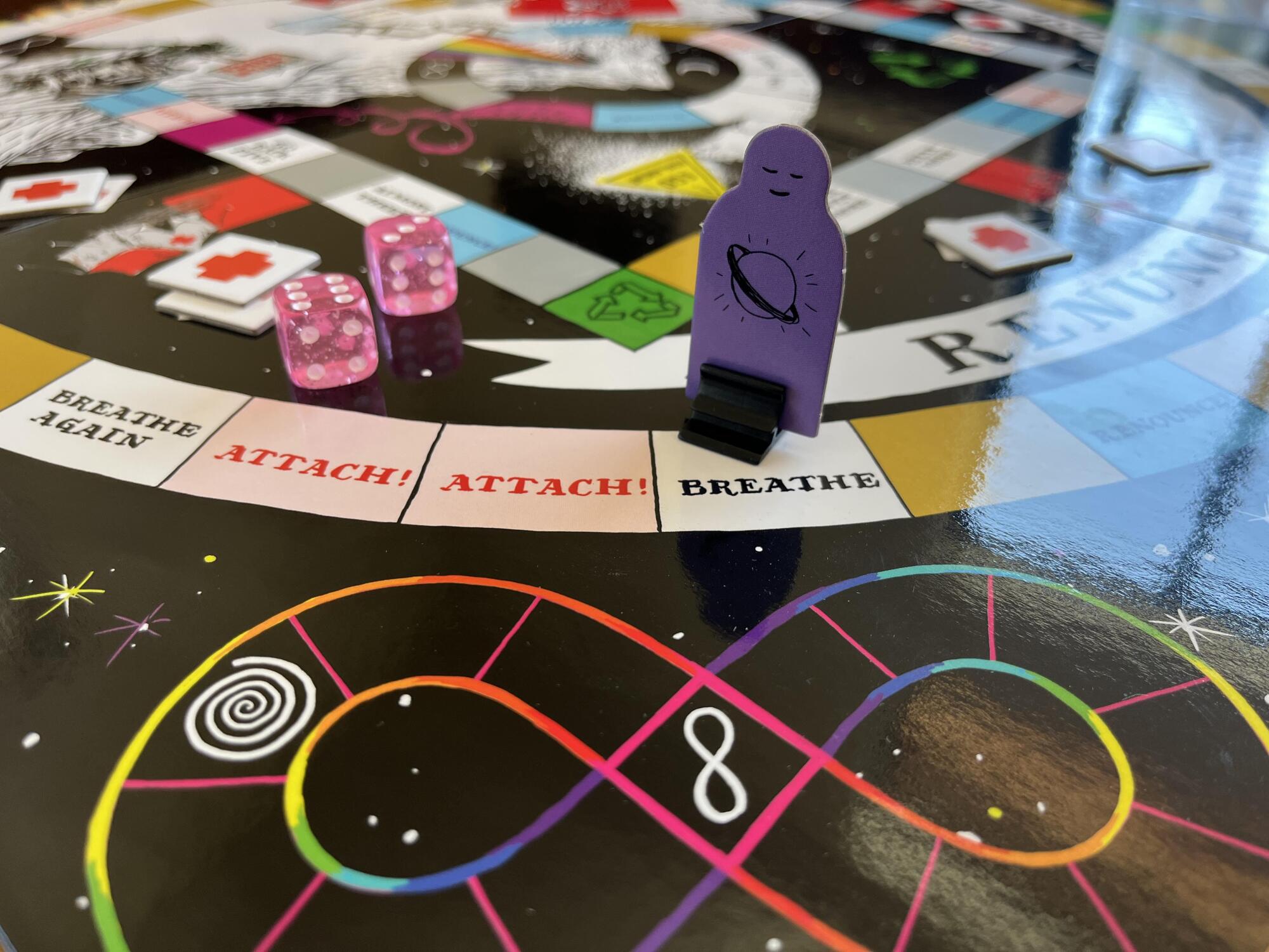 A round board game with esoteric symbols and words like "breathe" and "attach"