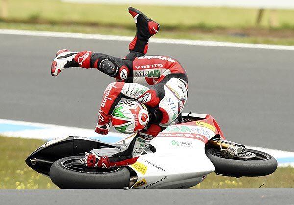 Roberto Locatelli, of Italy, flies off of his bike after crashing on turn 10 during the 250cc race at the Motorcycle Grand Prix at Phillip Island, Australia, on Sunday. The race was stopped with six laps to go after the crash. Locatelli escaped with only bruising on his lower back. Marco Simoncelli, also of Italy, won the race.