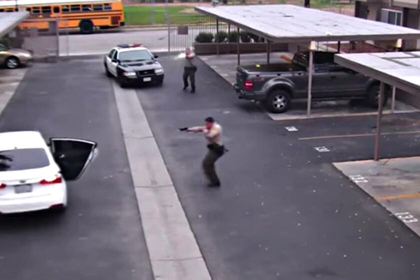 Framegrab from a Video released by the Los Angeles County Sheriff's Department shows deputies firing 34 rounds at an unarmed 24-year-old man in a Willowbrook apartment complex on June 6.