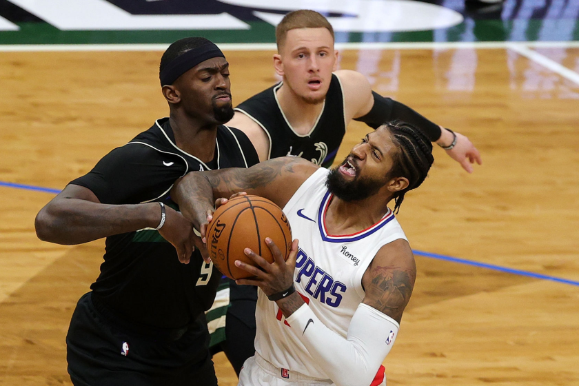 MILWAUKEE, WISCONSIN - FEBRUARY 28: Paul George #13 of the LA Clippers is defended by Bobby Portis.