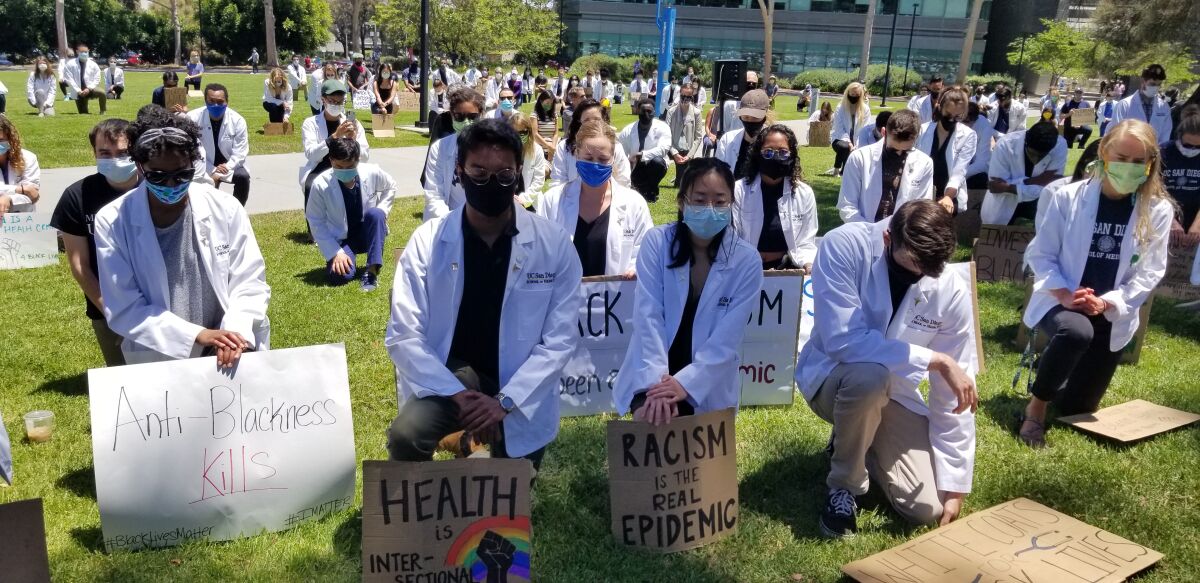 UC San Diego medical students kneel down
