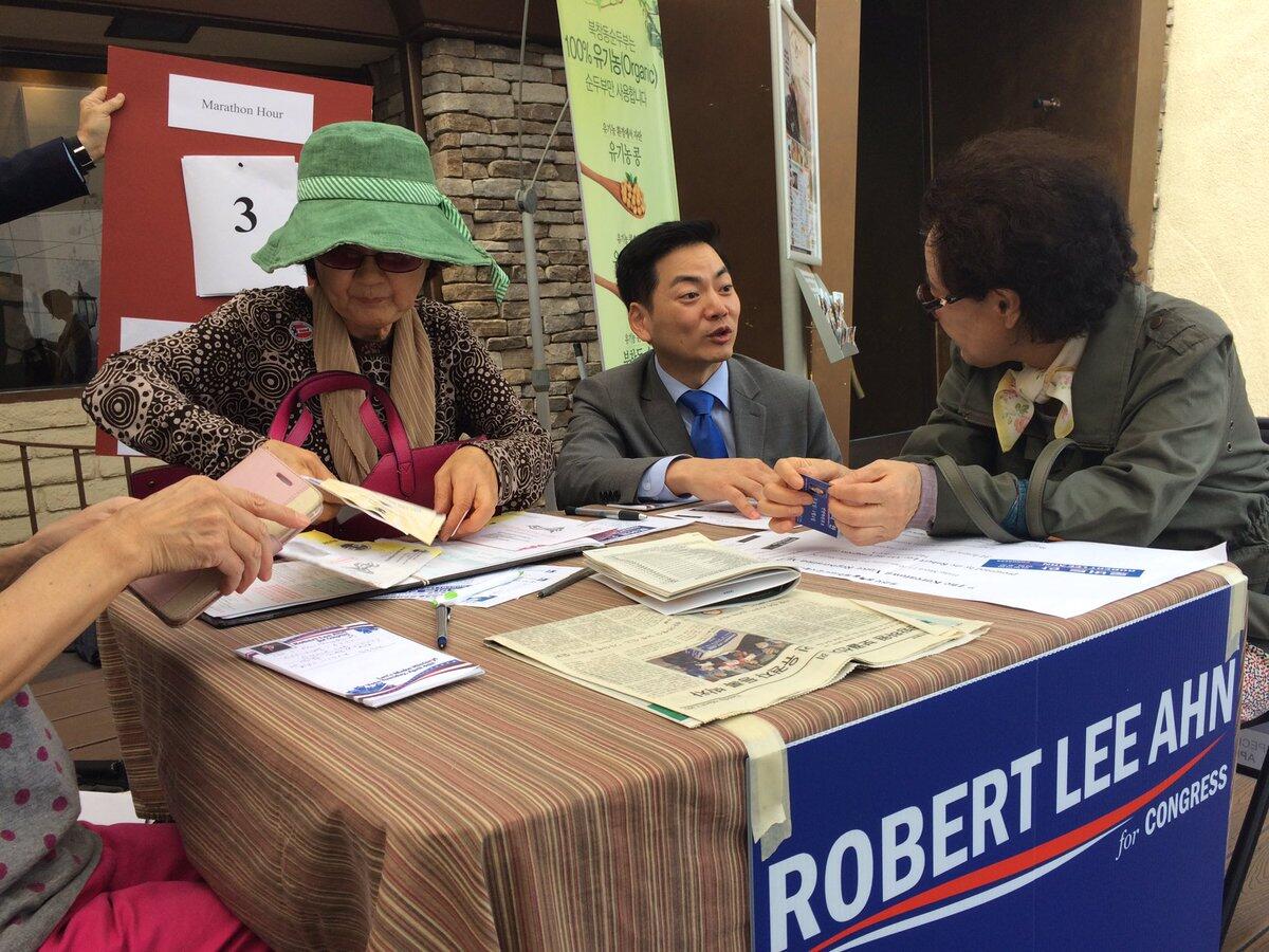 Robert Lee Ahn, center, is the only Korean American candidate running in a field dominated by Latinos in the 34th Congressional District race.