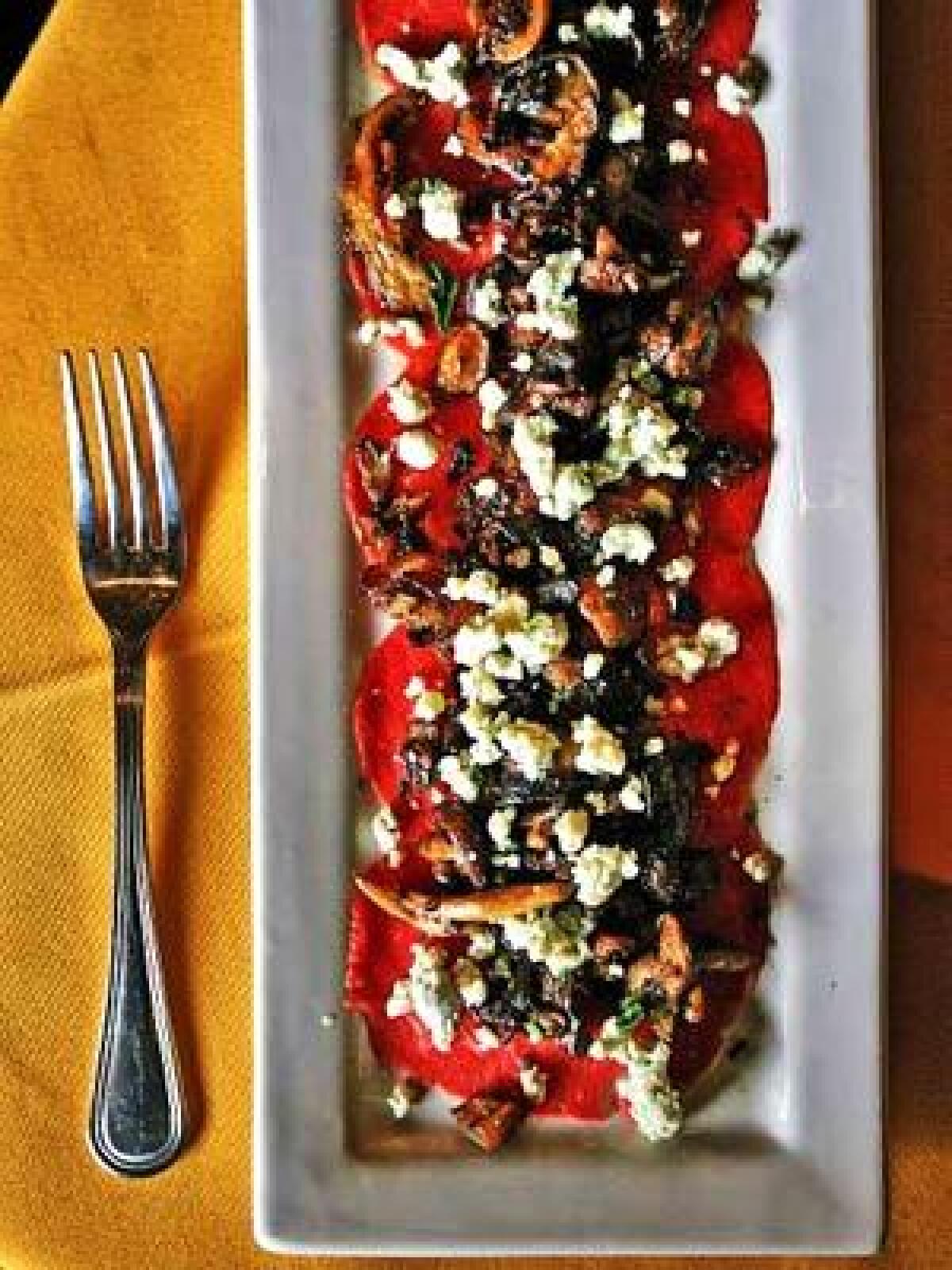 Beef carpaccio with roasted wild mushrooms, blue cheese, extra virgin olive oil and fresh pepper is served at Firenze Osteria in Toluca Lake.