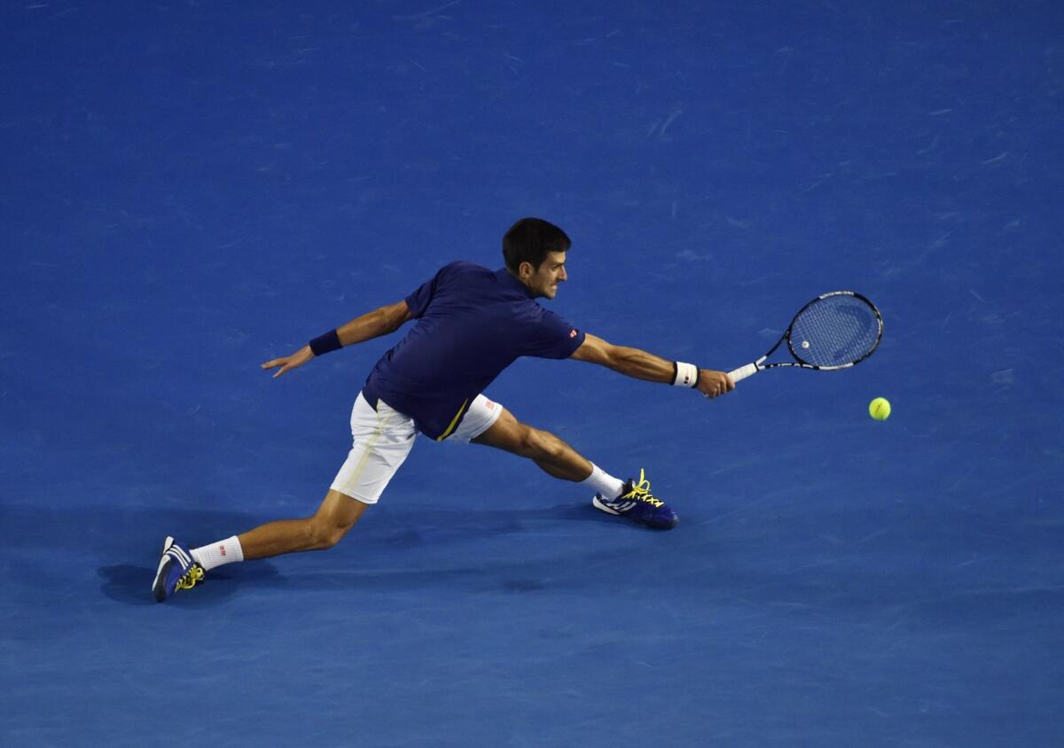 Serbia's Novak Djokovic plays a backhand return during his men's singles final match against Britain's Andy Murray.