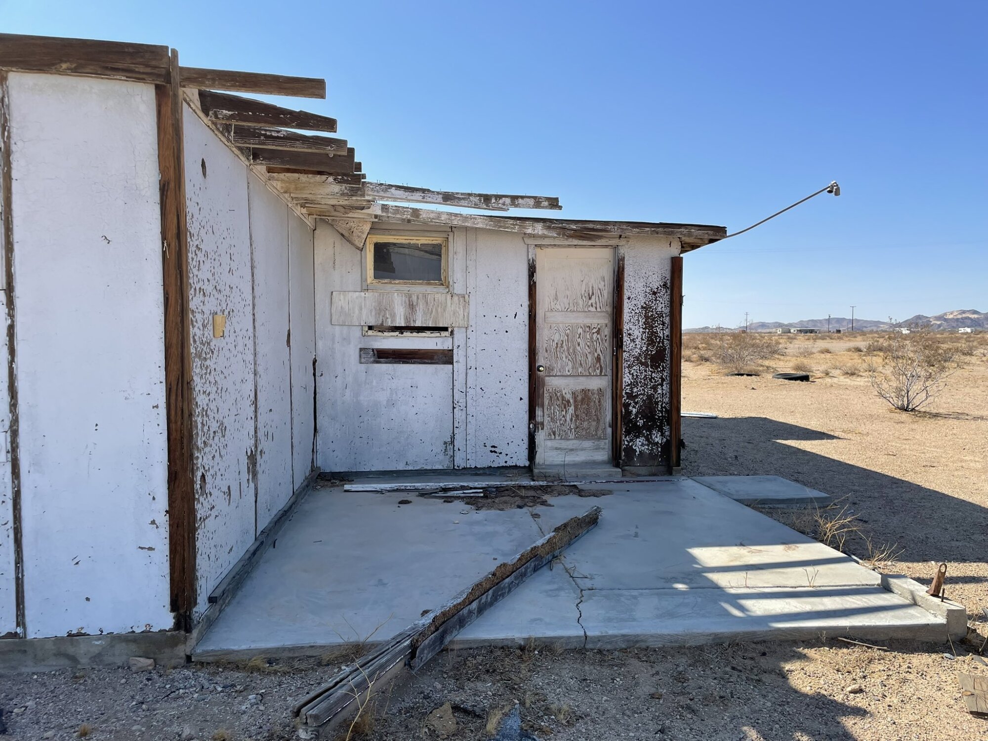 Exterior of abandoned house with weathered walls.