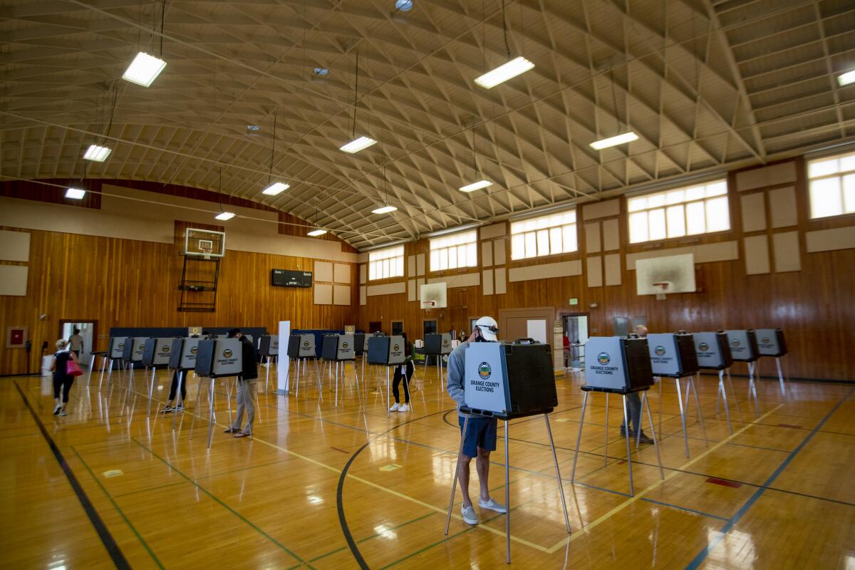 Voters cast their ballots at the Huntington Beach City Gym and Pool on Tuesday.