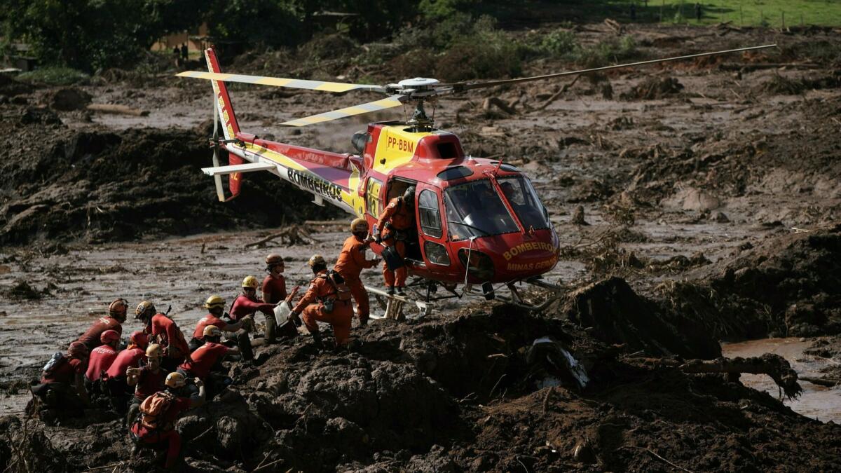 Firefighters are resupplied as they search last week for victims of the Vale dam collapse in Brumadinho, Brazil.
