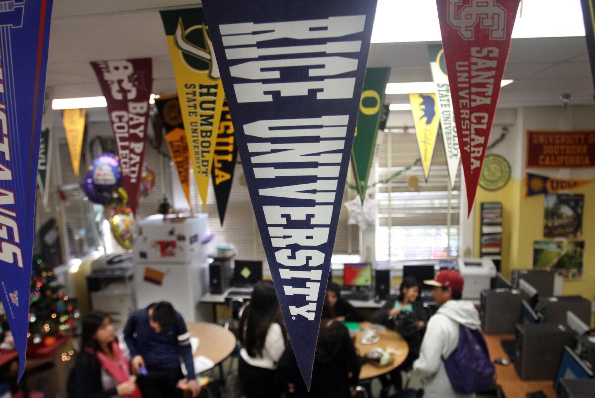 Students gather in the college counseling office at Roosevelt High School in Los Angeles. A new study finds a decline in the number of students apply to seven or more schools.