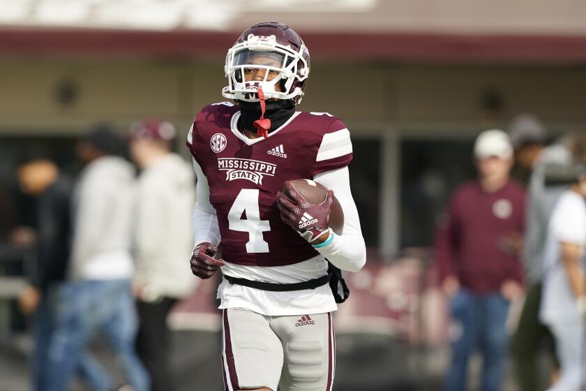 Mississippi State cornerback DeCarlos Nicholson (4) runs the ball upfield during pregame drills of an NCAA college football game against East Tennessee State in Starkville, Miss., Saturday, Nov.19, 2022. Mississippi State won 56-7. (AP Photo/Rogelio V. Solis)
