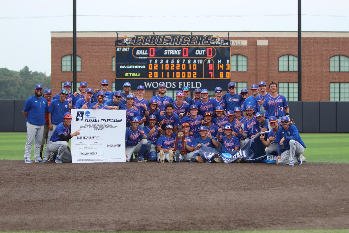 The Pomona Pitzer baseball team taking a group photo with a large certificate, scoreboard in background