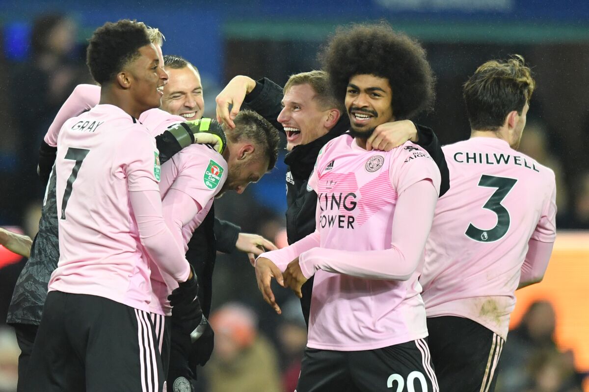 Leicester players celebrate their English League Cup quarterfinal win over Everton on Wednesday.