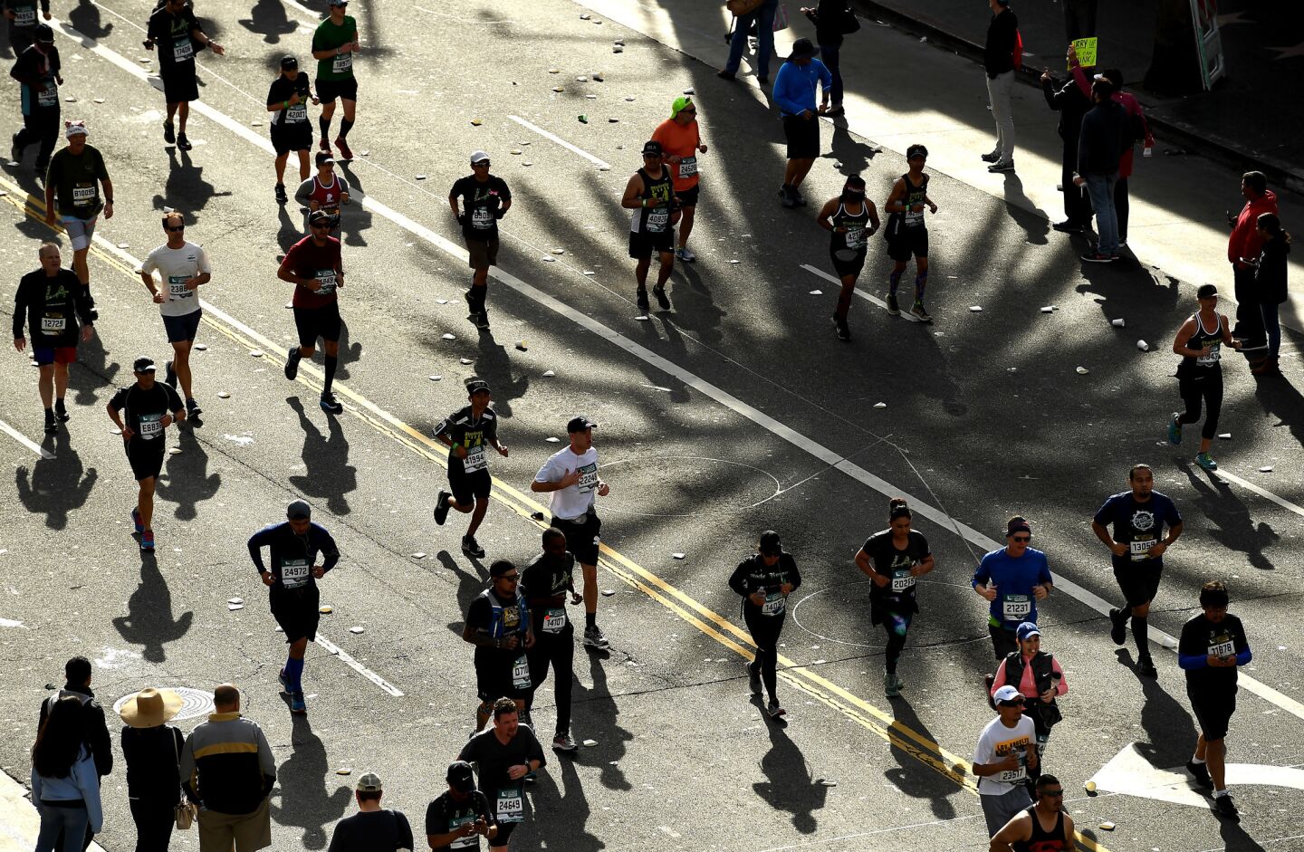 Crowds run along Hollywood Blvd. during the L.A. Marathon.
