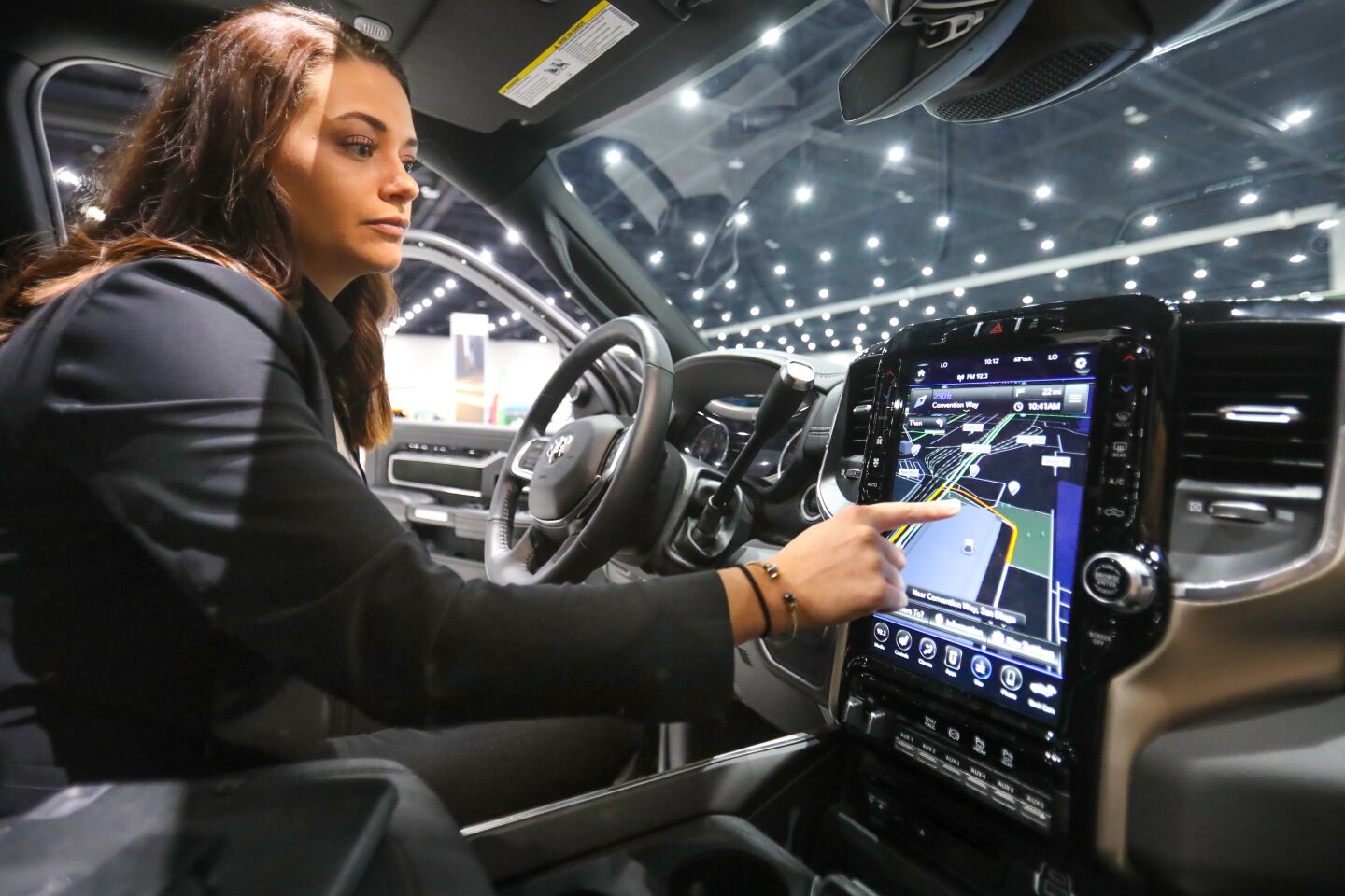 Emily, a product specialist in the Fiat Chrysler Automobiles display space during the 2020 San Diego International Auto Show, January 4, 2020 at the San Diego Convention Center, demonstrates the 12 inch in-vehicle touchscreen display, in a 2019 Ram 2500 Laramie Crew Cab 4x4 pickup truck.