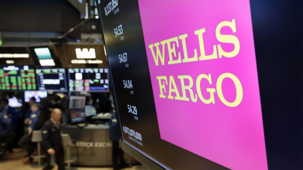 The Wells Fargo logo above a trading post on the floor of the New York Stock Exchange.