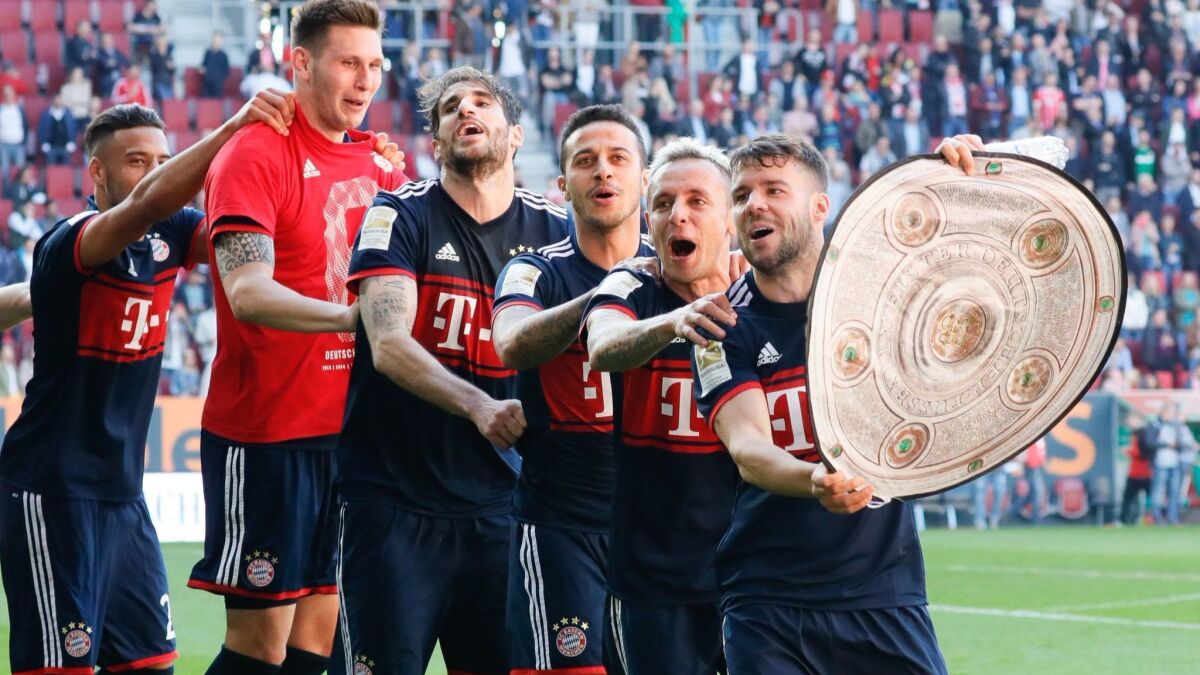 Bayern Munich players celebrate winning the sixth consecutive Bundesliga title on Saturday.