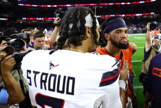 HOUSTON, TEXAS - SEPTEMBER 15: C.J. Stroud #7 of the Houston Texans shakes hands with Caleb Williams #18 of the Chicago Bears following the game at NRG Stadium on September 15, 2024 in Houston, Texas. (Photo by Alex Slitz/Getty Images)