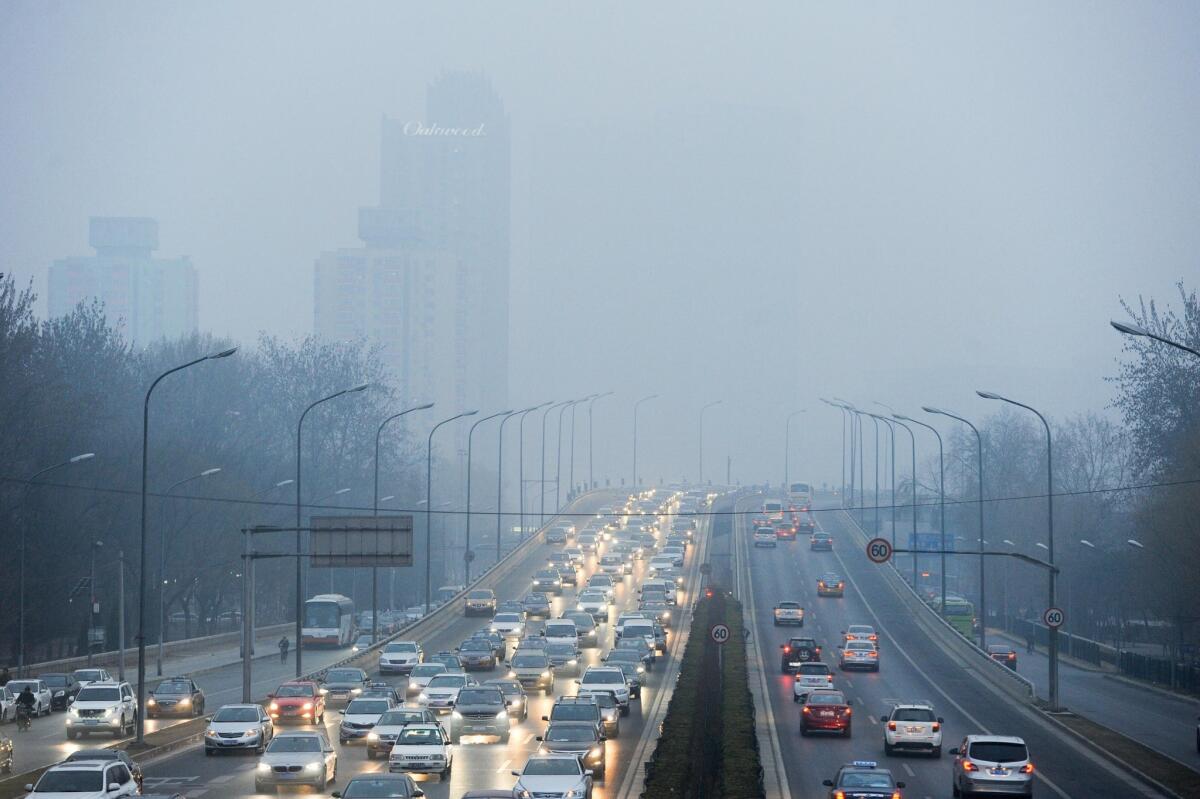 Motorists in smog-choked Beijing on March 16, 2015. China is falling short of its people's expectations in battling smog, Premier Li Keqiang said on March 15, one week after authorities blocked a scathing documentary on the country's air pollution problem.
