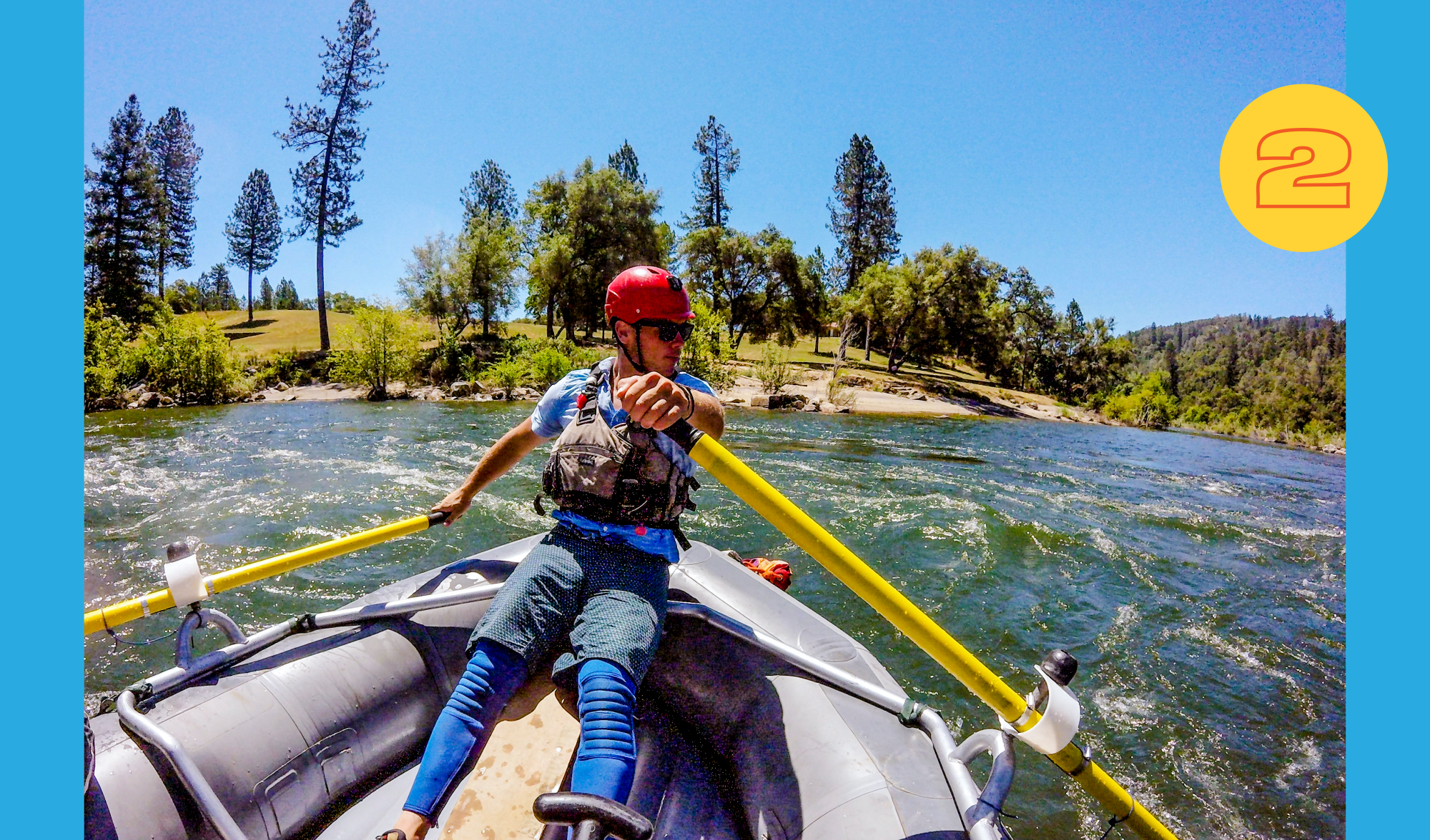 River guide Kyle Brazil rows with oars in a boat on a calm river.