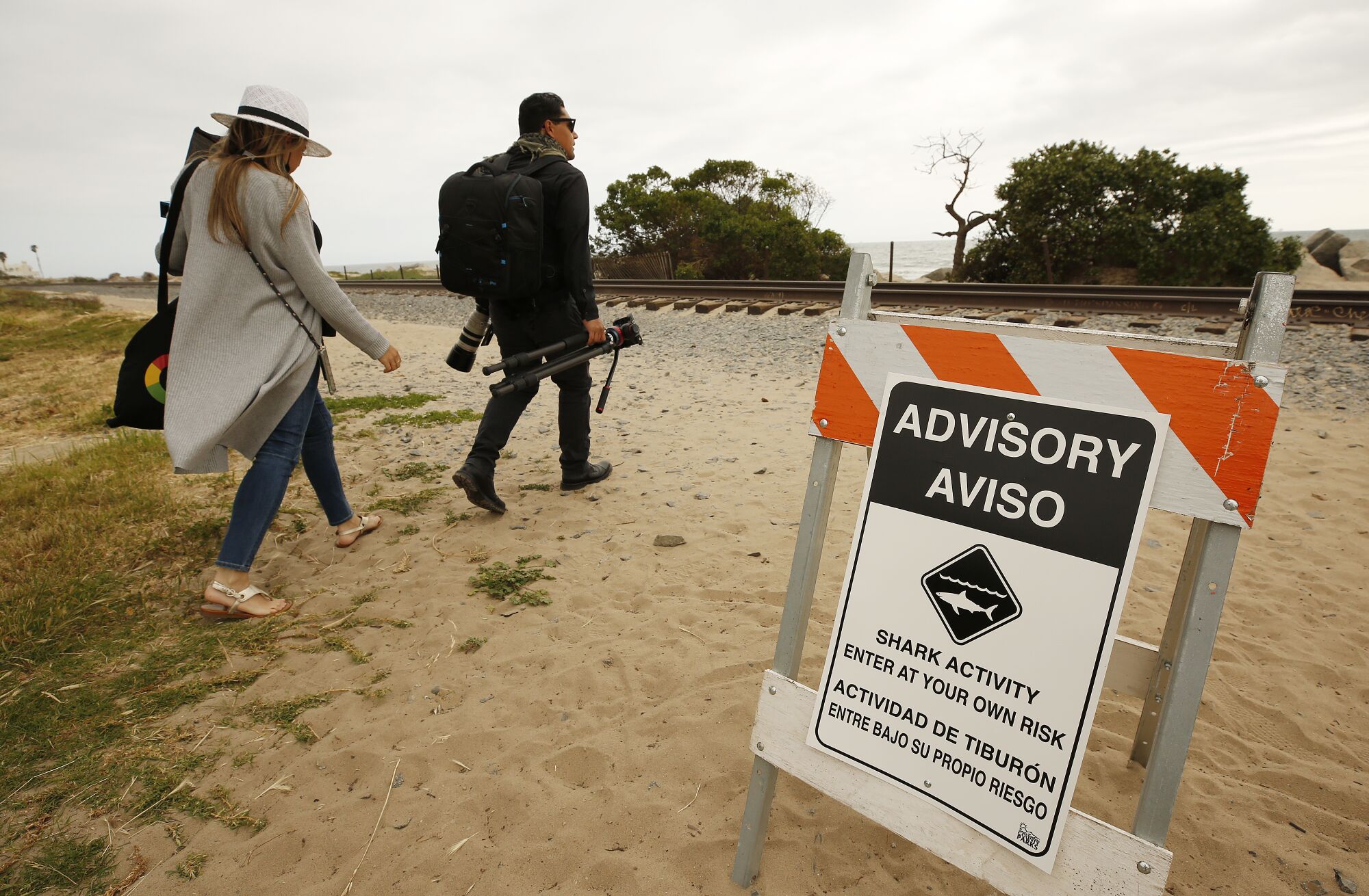Drone photographer Carlos Gauna and his wife, Andressa, head to a beach along the Santa Barbara County coast.