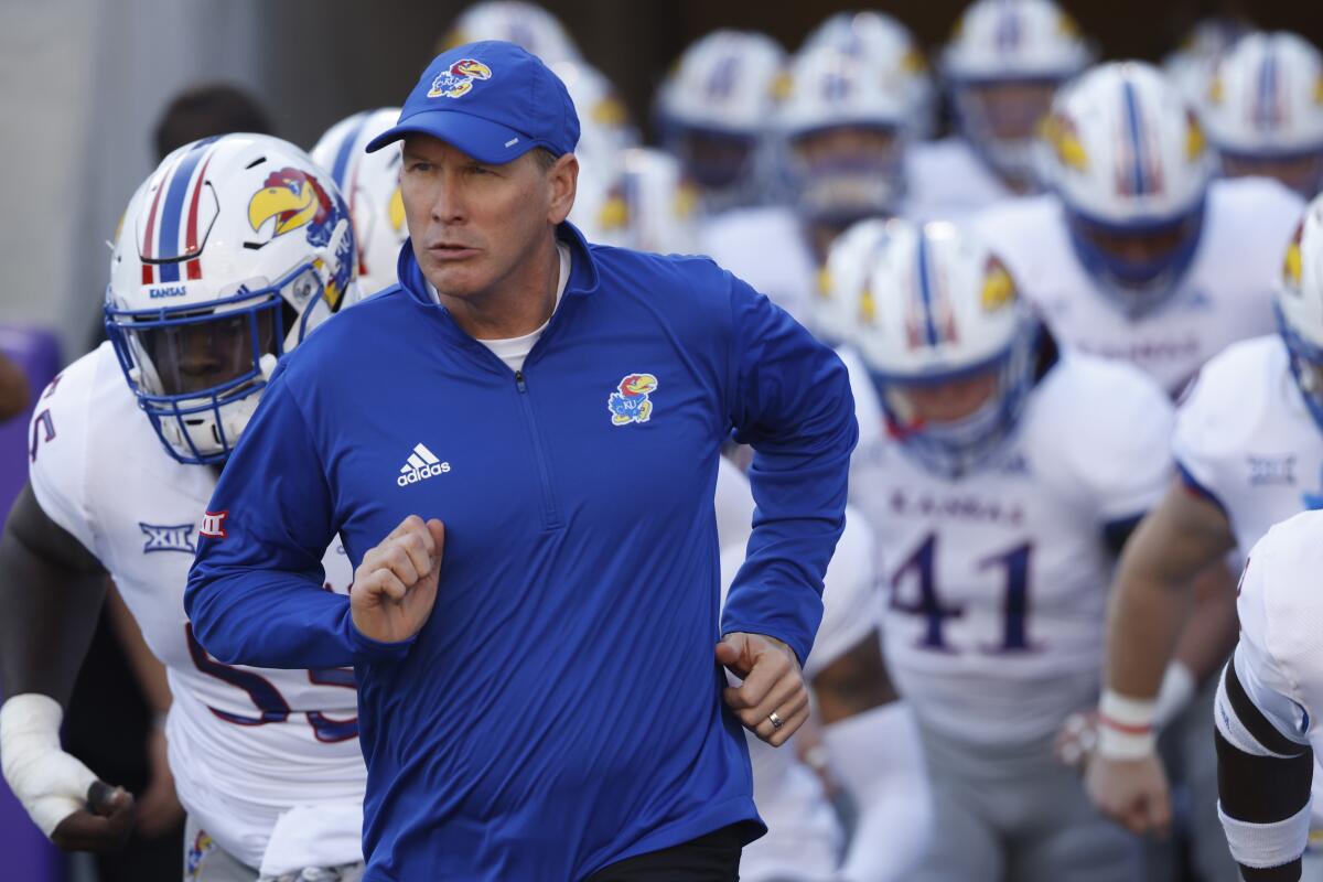 FILE - Kansas head coach Lance Leipold takes the field with his team before playing TCU in an NCAA college football game Saturday, Nov. 20, 2021, in Fort Worth, Texas. Kansas is set to kick off its season on Sept. 2, 2022, against Tennessee Tech. (AP Photo/Ron Jenkins, File)
