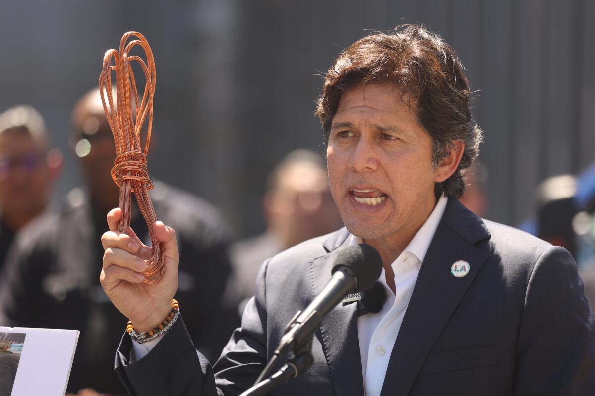 Los Angeles Councilmember Kevin de León speaks while holding copper wire on July 30.