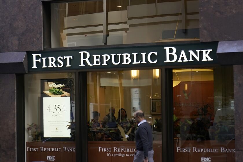 FILE - A pedestrian walks past a First Republic Bank in San Francisco on April 26, 2023. Regulators continued their search for a solution to First Republic Bank’s woes over the weekend before stock markets were set to open Monday, May 1. (AP Photo/Jeff Chiu, File)