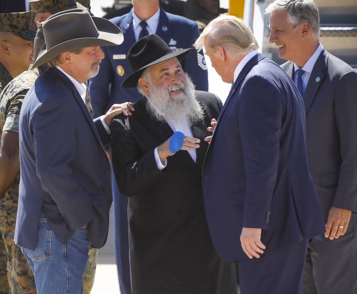 Rabbi Yisroel Goldstein, with Poway Mayor Steve Vaus, greets President Trump