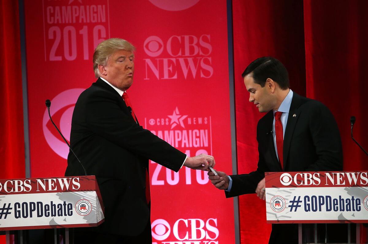 Donald Trump gives Sen. Marco Rubio (R-Fla.) candies during the Republican presidential debate on Feb. 13. Is Harry Potter an apt metaphor for Rubio?